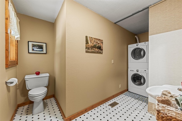 747 Bear Cove Cir, Bryson City, NC 28713 - laundry area featuring stacked washer / dryer and light flooring