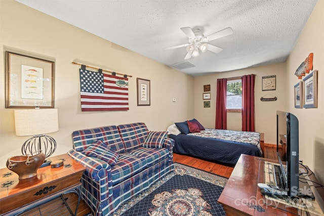 747 Bear Cove Cir, Bryson City, NC 28713 - bedroom with wood finished floors, a textured ceiling, and ceiling fan