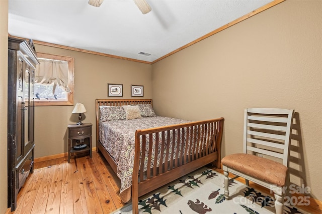 747 Bear Cove Cir, Bryson City, NC 28713 - bedroom with light wood finished floors and ceiling fan