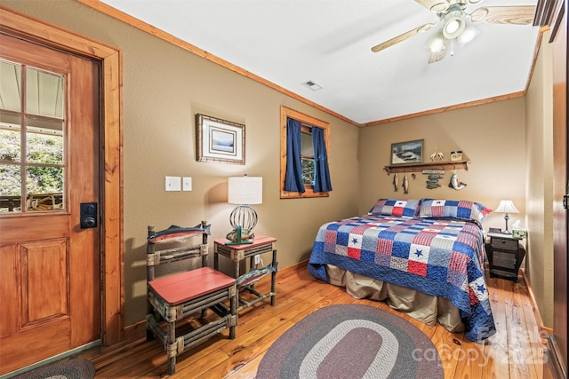 747 Bear Cove Cir, Bryson City, NC 28713 - bedroom featuring hardwood / wood-style flooring, ceiling fan, and crown molding