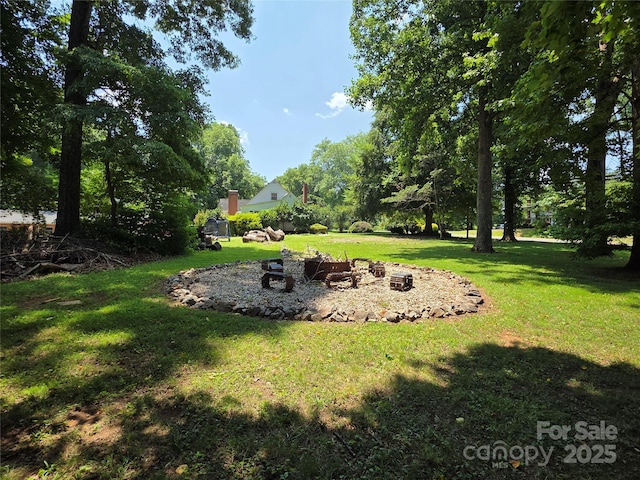 7335 US Highway 52, Salisbury, NC 28146 - view of grassy yard with an outdoor fire pit