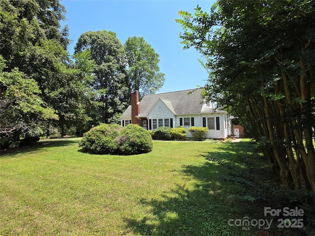 7335 US Highway 52, Salisbury, NC 28146 - rear view of house with a chimney and a lawn