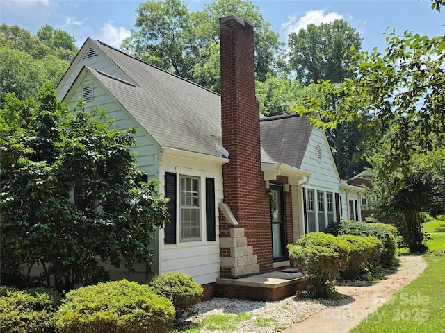 7335 US Highway 52, Salisbury, NC 28146 - view of front of house featuring roof with shingles and a chimney
