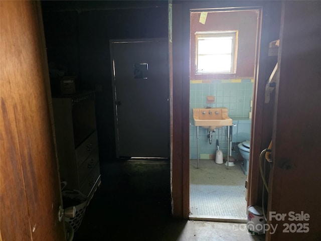 7335 US Highway 52, Salisbury, NC 28146 - hallway with tile walls and wainscoting
