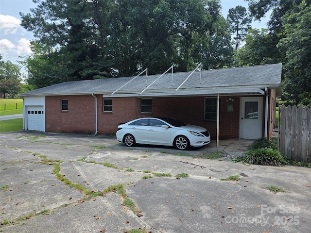 7335 US Highway 52, Salisbury, NC 28146 - view of front facade with driveway, brick siding, a shingled roof, and a garage