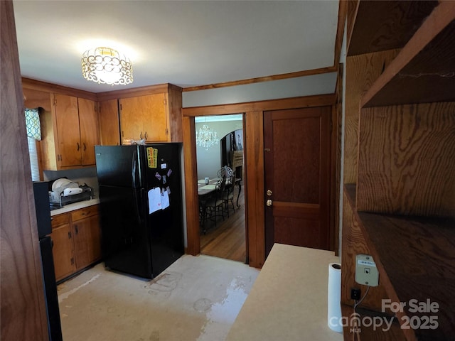 7335 US Highway 52, Salisbury, NC 28146 - kitchen featuring freestanding refrigerator, brown cabinets, and light countertops