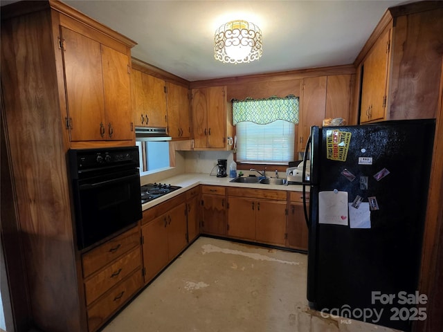 7335 US Highway 52, Salisbury, NC 28146 - kitchen featuring black appliances, under cabinet range hood, brown cabinetry, and light countertops