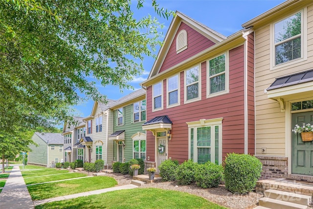 1727 Evergreen Dr, Charlotte, NC 28208 - view of property featuring a residential view, a front yard, and a standing seam roof