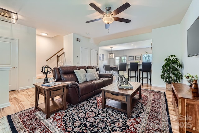 1727 Evergreen Dr, Charlotte, NC 28208 - living area featuring light wood finished floors, ceiling fan, stairway, and recessed lighting