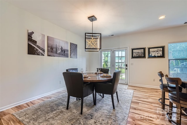 1727 Evergreen Dr, Charlotte, NC 28208 - dining area featuring light wood finished floors and recessed lighting
