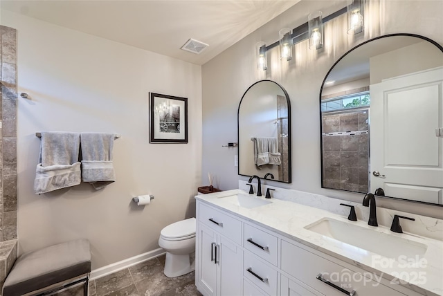 1727 Evergreen Dr, Charlotte, NC 28208 - full bathroom with double vanity and a tile shower