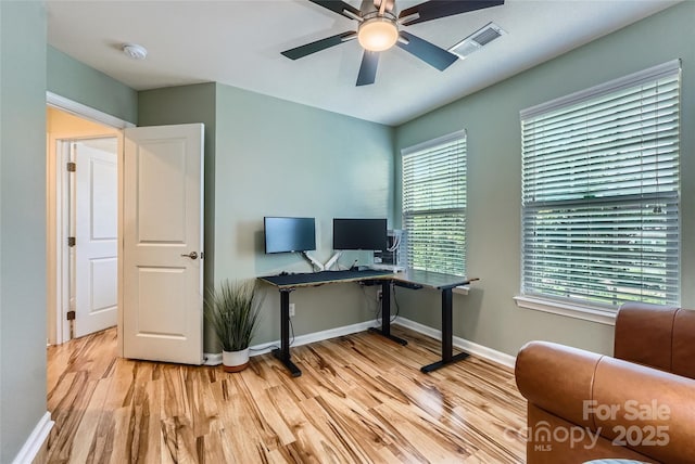 1727 Evergreen Dr, Charlotte, NC 28208 - office area featuring wood finished floors, ceiling fan, and healthy amount of natural light