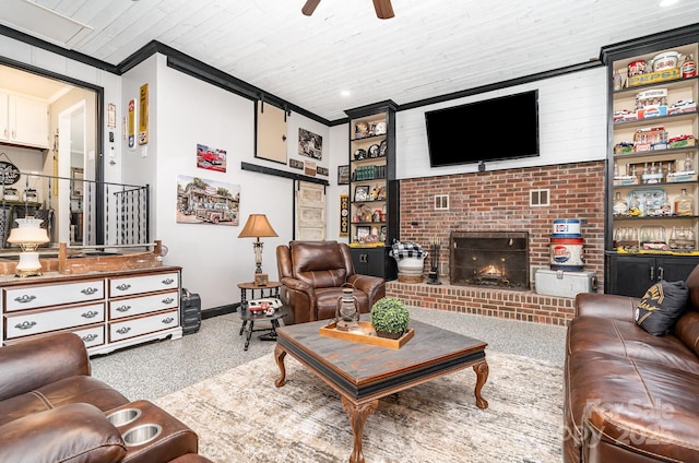 4710 Mooresville Rd, Salisbury, NC 28147 - living room featuring speckle patterned floor, a ceiling fan, a fireplace, and ornamental molding