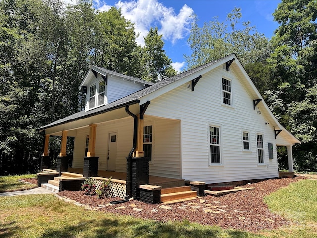 1805 Swan Dr SW, Lenoir, NC 28645 - view of side of home with covered porch and a shingled roof