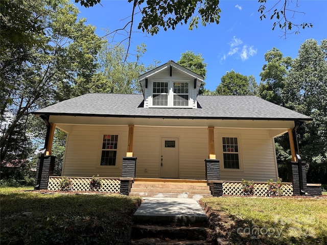 1805 Swan Dr SW, Lenoir, NC 28645 - view of front of property with a porch, a shingled roof, and a front lawn