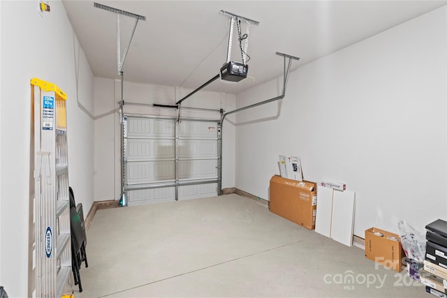 3740 Backwater St, Concord, NC 28027 - garage featuring a garage door opener and baseboards
