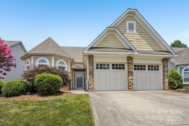 2607 Old Ashworth Ln NW, Concord, NC 28027 - view of front of property with roof with shingles, concrete driveway, an attached garage, and stone siding