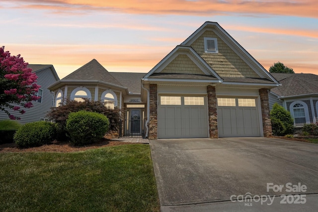 2607 Old Ashworth Ln NW, Concord, NC 28027 - view of front of home featuring an attached garage, driveway, stone siding, and a front yard