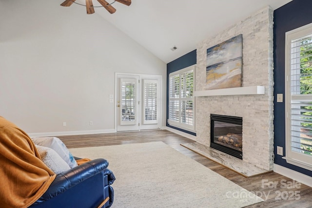 2607 Old Ashworth Ln NW, Concord, NC 28027 - living room featuring ceiling fan, high vaulted ceiling, wood finished floors, and a fireplace