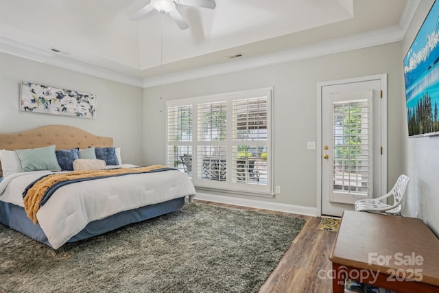 2607 Old Ashworth Ln NW, Concord, NC 28027 - bedroom featuring wood finished floors, a raised ceiling, access to outside, crown molding, and ceiling fan