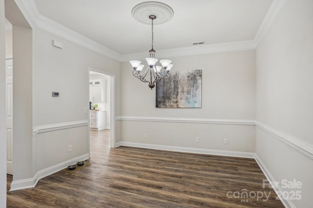 2607 Old Ashworth Ln NW, Concord, NC 28027 - empty room featuring crown molding, a chandelier, and wood finished floors