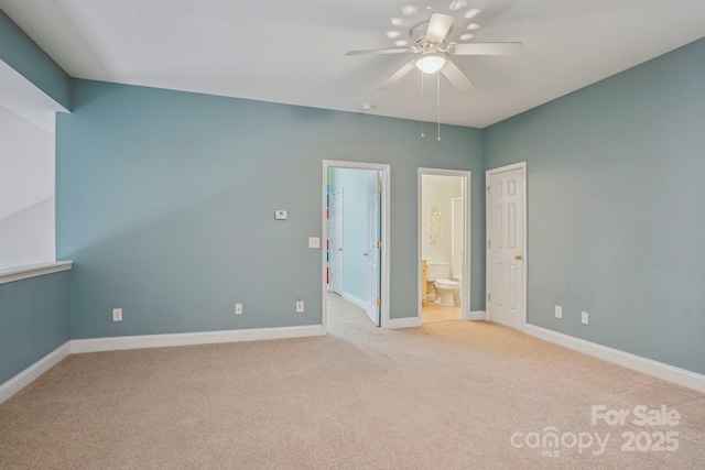 2607 Old Ashworth Ln NW, Concord, NC 28027 - unfurnished bedroom with light colored carpet, ensuite bath, and a ceiling fan