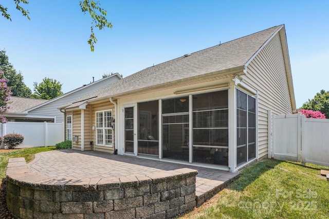 2607 Old Ashworth Ln NW, Concord, NC 28027 - rear view of property with a sunroom, a patio area, and a shingled roof