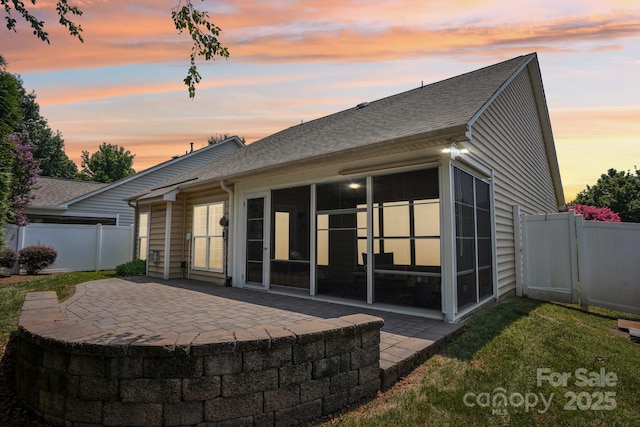 2607 Old Ashworth Ln NW, Concord, NC 28027 - rear view of property featuring a sunroom, roof with shingles, and a patio area