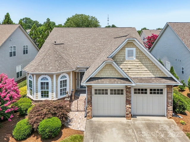 2607 Old Ashworth Ln NW, Concord, NC 28027 - view of front of property featuring concrete driveway, roof with shingles, and stone siding