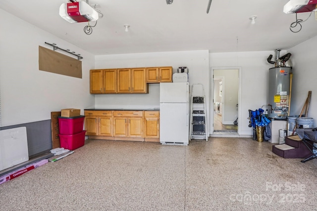 2607 Old Ashworth Ln NW, Concord, NC 28027 - garage featuring freestanding refrigerator, a garage door opener, and water heater