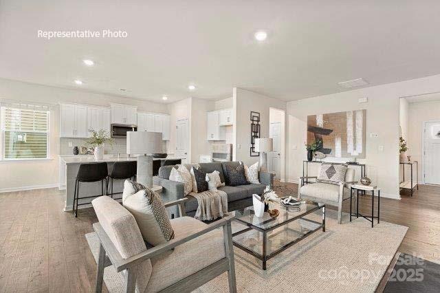 9235 Poquoson Dr, Gastonia, NC 28056 - living area featuring wood finished floors and recessed lighting