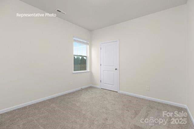 9235 Poquoson Dr, Gastonia, NC 28056 - spare room featuring carpet floors