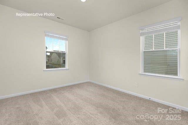 9235 Poquoson Dr, Gastonia, NC 28056 - carpeted spare room featuring baseboards