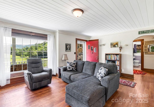 5215 Double Island Rd, Green Mountain, NC 28740 - living room with arched walkways, wood-type flooring, ornamental molding, and wooden ceiling