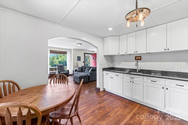 5215 Double Island Rd, Green Mountain, NC 28740 - kitchen featuring arched walkways, white cabinetry, dark wood-style flooring, and recessed lighting