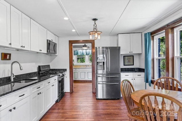 5215 Double Island Rd, Green Mountain, NC 28740 - kitchen with stainless steel appliances, plenty of natural light, dark stone counters, white cabinetry, and recessed lighting