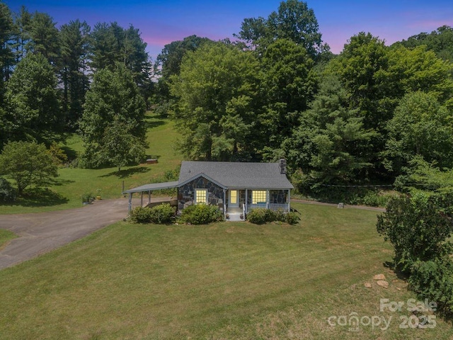 5215 Double Island Rd, Green Mountain, NC 28740 - view of front facade featuring driveway, a front lawn, stone siding, and a carport