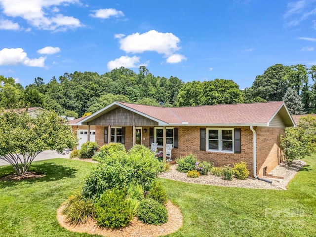 313 Resada Dr, Brevard, NC 28712 - ranch-style home with brick siding, a front lawn, a garage, and a shingled roof