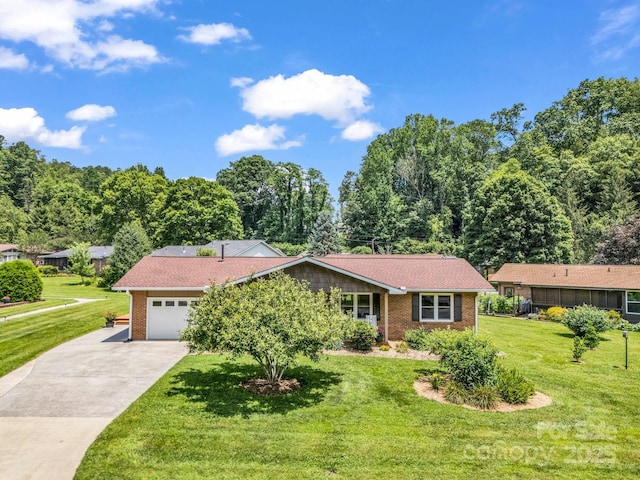 313 Resada Dr, Brevard, NC 28712 - ranch-style home featuring driveway, brick siding, a front yard, and an attached garage
