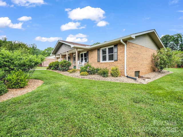 313 Resada Dr, Brevard, NC 28712 - back of house with brick siding, a lawn, and a porch