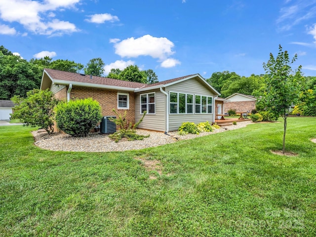 313 Resada Dr, Brevard, NC 28712 - back of property with a yard and brick siding