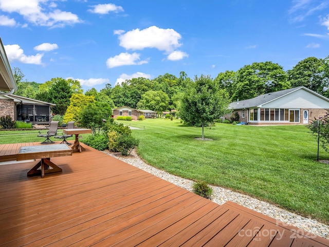 313 Resada Dr, Brevard, NC 28712 - wooden deck with a sunroom, a yard, and view of scattered trees
