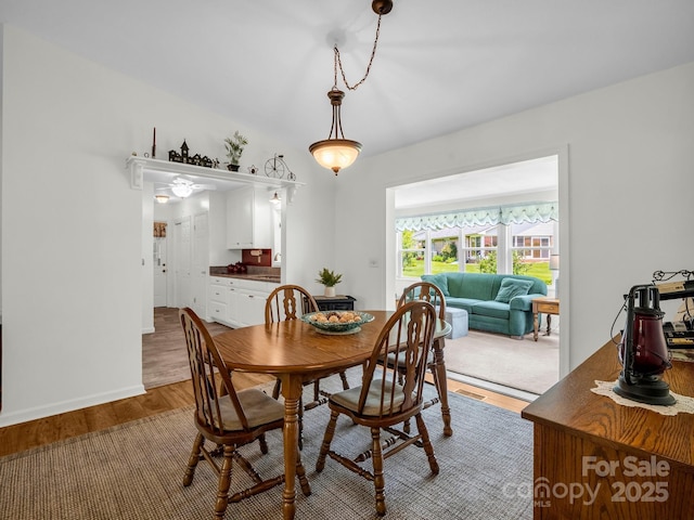 313 Resada Dr, Brevard, NC 28712 - dining space with wood finished floors and vaulted ceiling