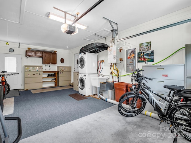 313 Resada Dr, Brevard, NC 28712 - garage with stacked washing machine and dryer and a garage door opener