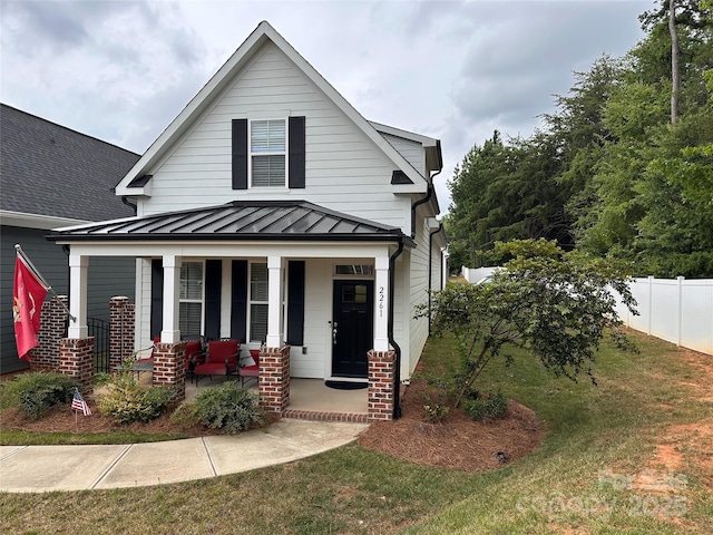 2261 Moss Haven Ln, Denver, NC 28037 - view of front of house with a standing seam roof, covered porch, and a metal roof