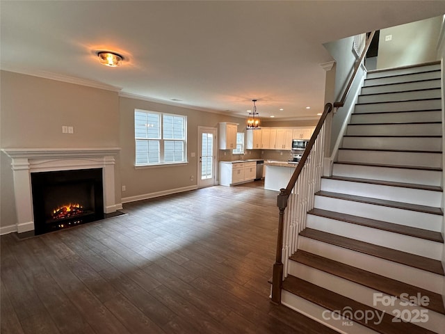 2261 Moss Haven Ln, Denver, NC 28037 - unfurnished living room featuring crown molding, a fireplace with flush hearth, stairway, dark wood-style flooring, and recessed lighting