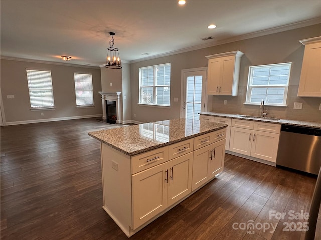 2261 Moss Haven Ln, Denver, NC 28037 - kitchen featuring dishwasher, dark wood-style flooring, crown molding, a center island, and white cabinets