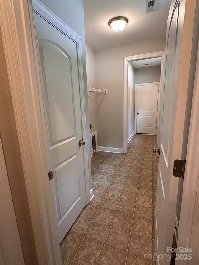 2261 Moss Haven Ln, Denver, NC 28037 - hallway with baseboards and dark tile patterned flooring