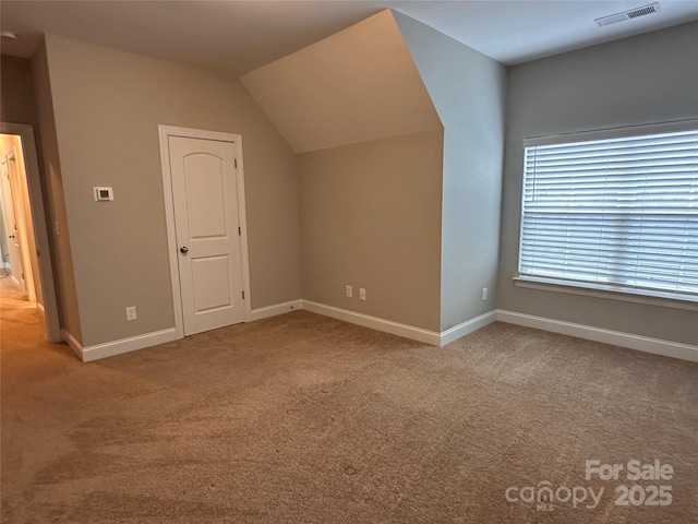 2261 Moss Haven Ln, Denver, NC 28037 - additional living space with carpet floors and vaulted ceiling