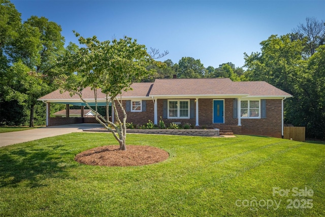 207 Valdese Dr, Morganton, NC 28655 - single story home featuring concrete driveway, a front yard, brick siding, and a carport